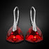 Sudraba auskari "Vakara Mirdzums (Light Siam Comet Argent Light)" ar Swarovski™ kristāliem